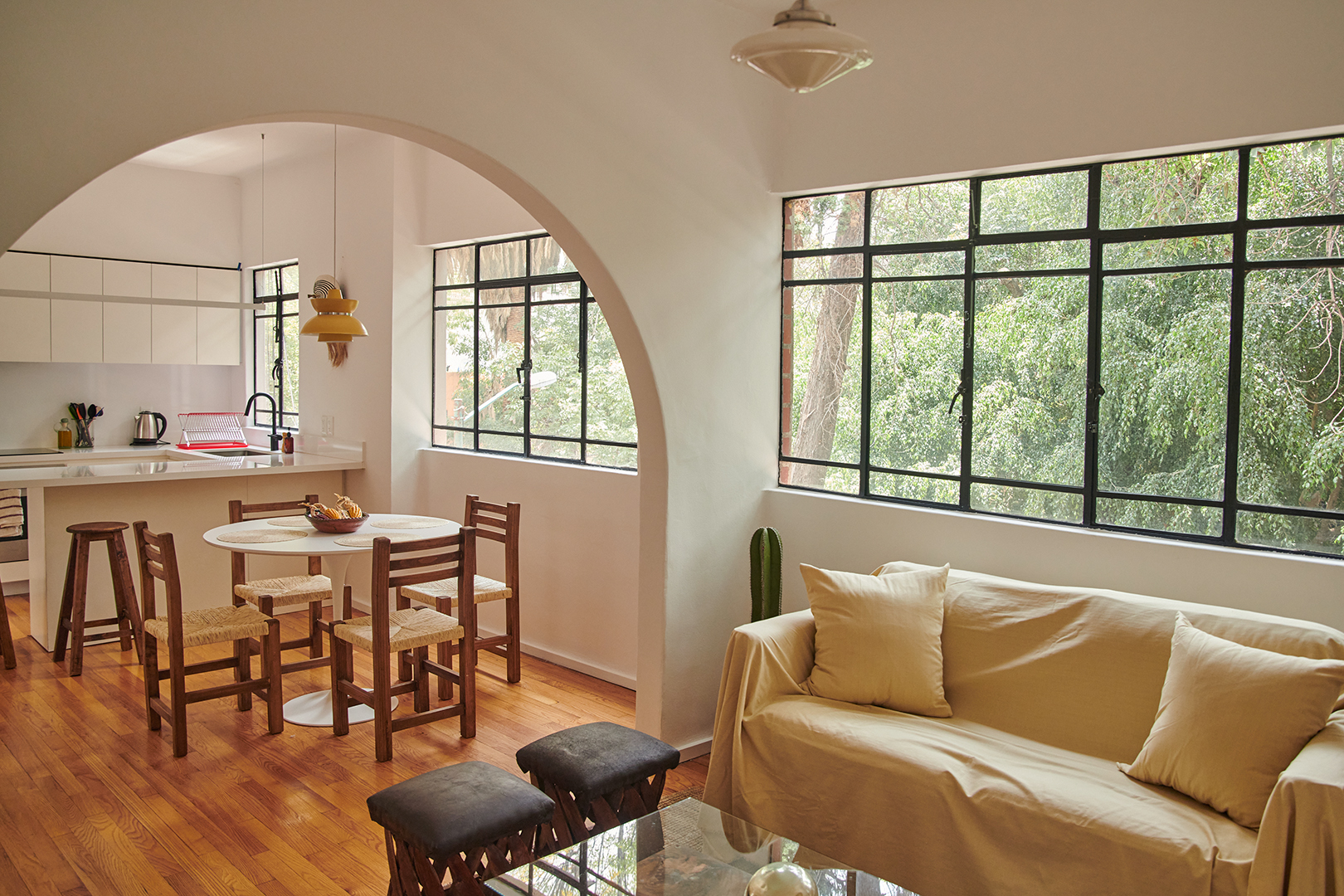 Living room with slipcovered sofa and dining room