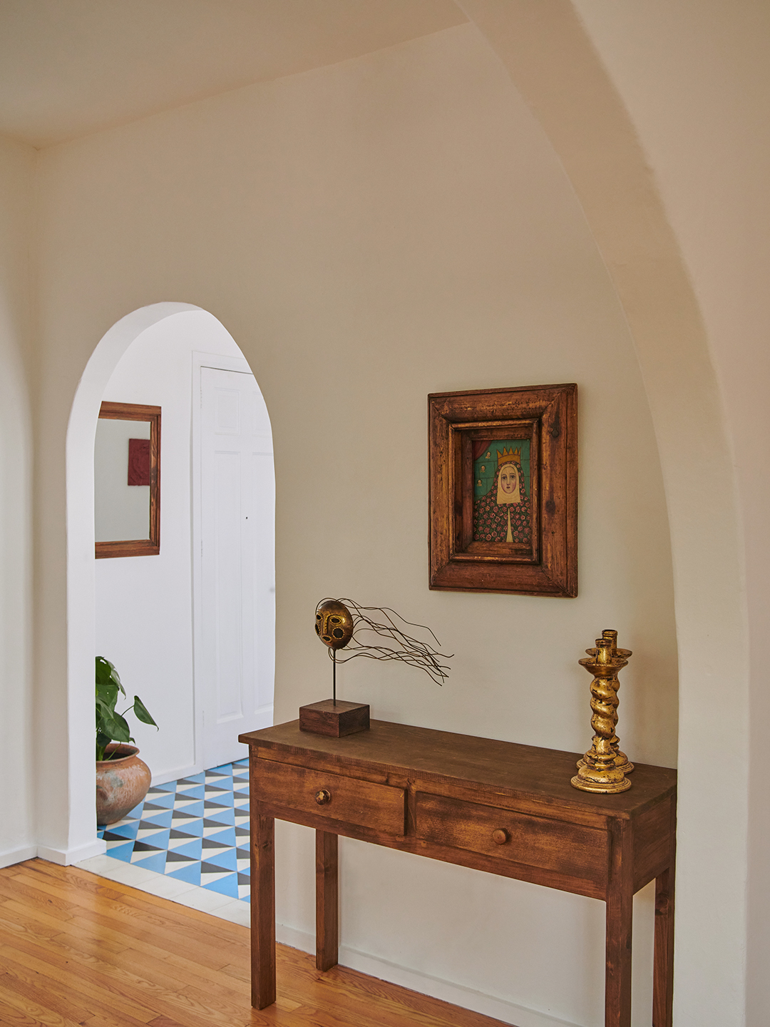 wooden table near arched entryway