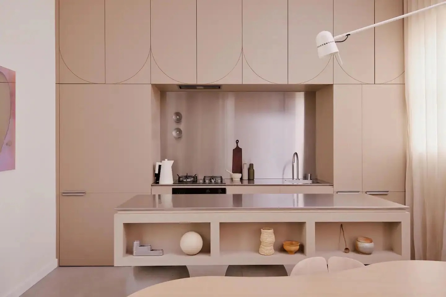 Minimalist kitchen with pink cabinetry