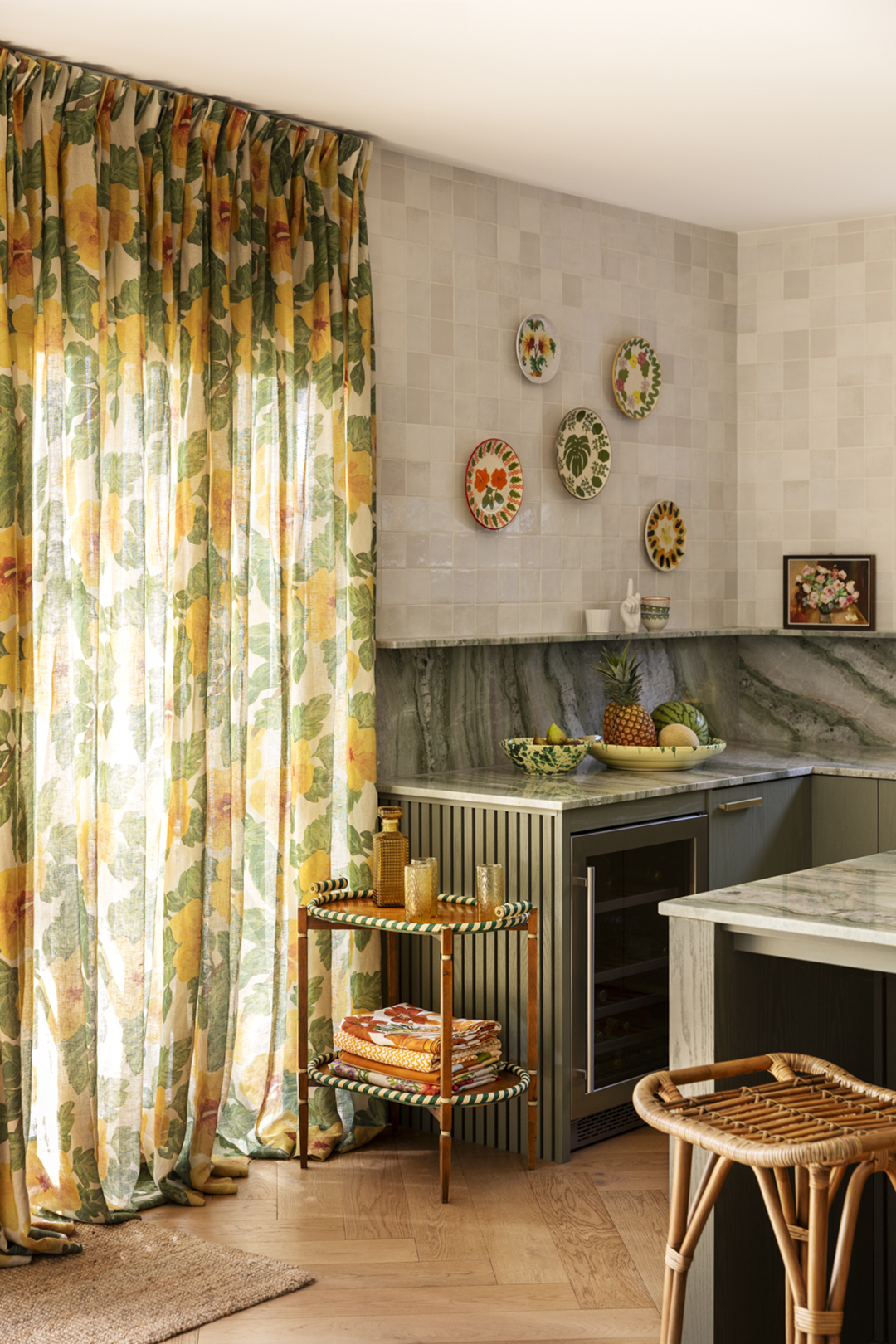 Green kitchen with patterned curtains