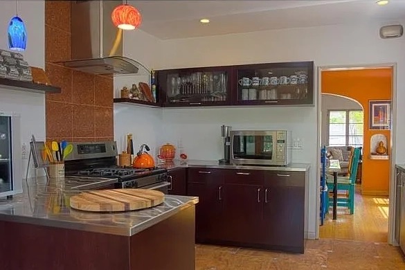 brown cabinets and orange backsplash