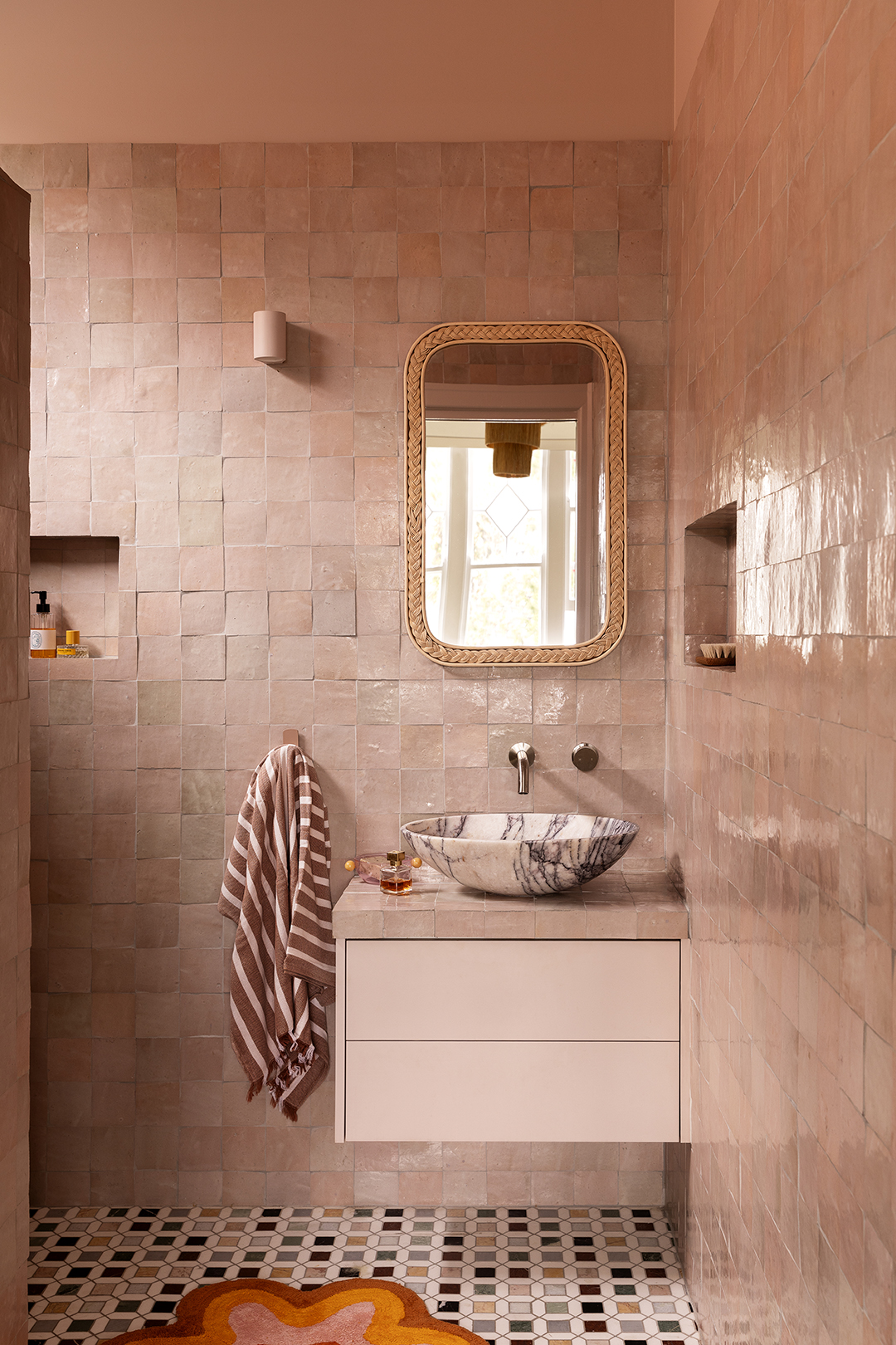 Primary bathroom with pink tile.