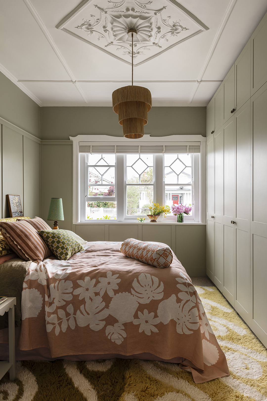 Bedroom with wall of built-in storage.