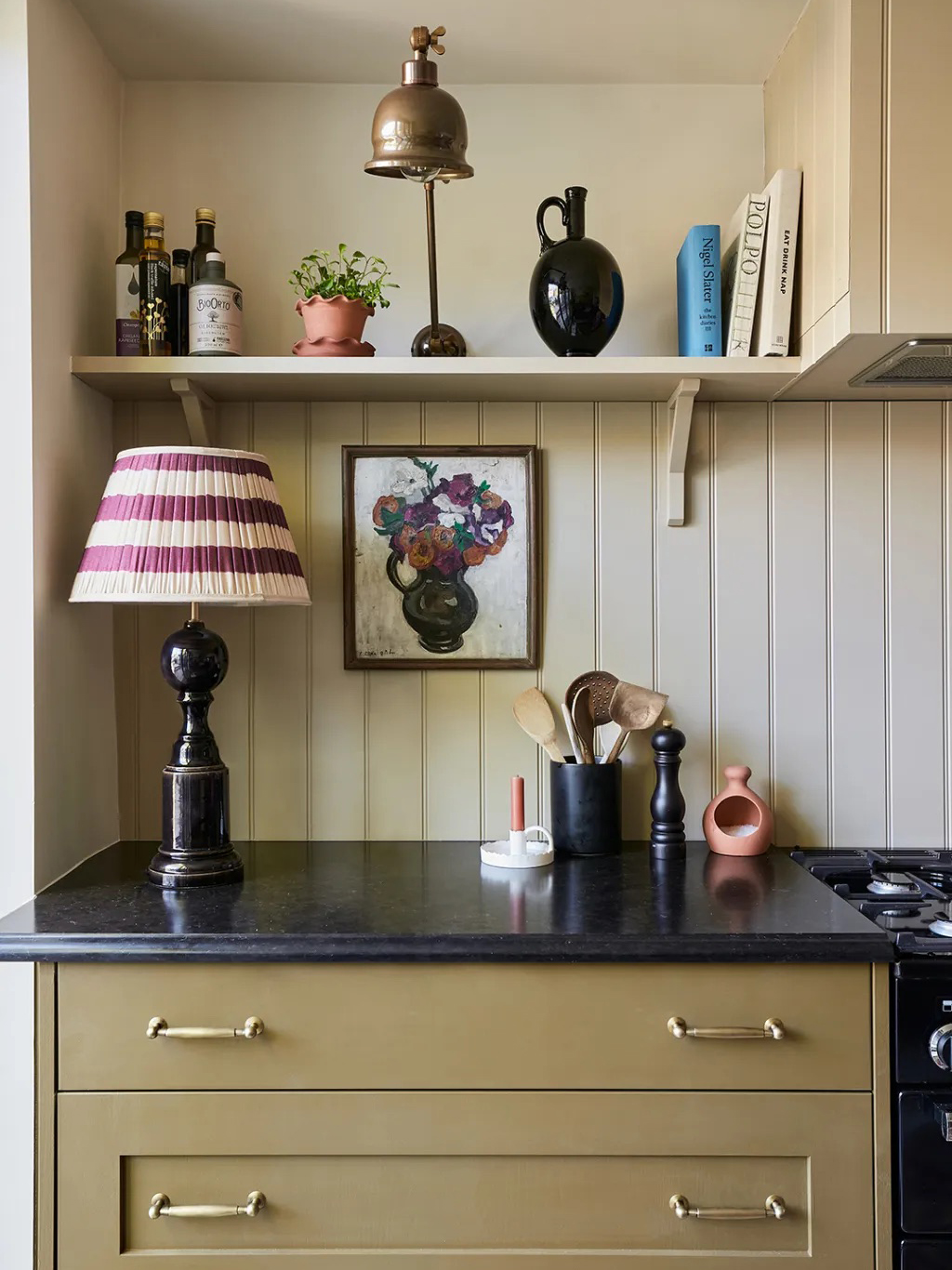 green cabinets with black counter