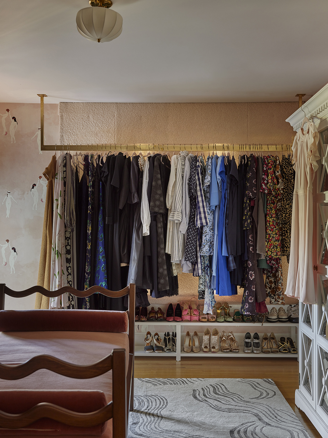 colorful clothing on brass rack