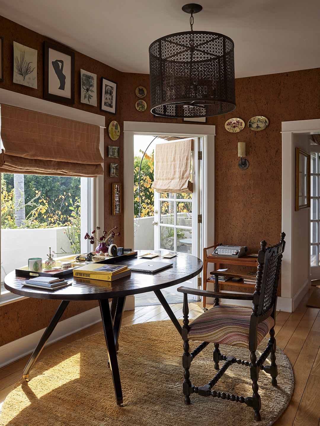 oval desk in front of window