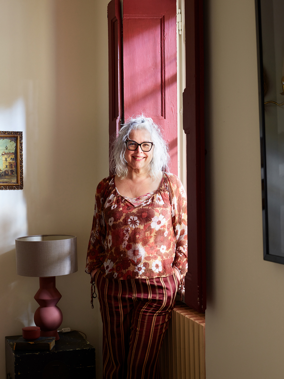 woman standing near window