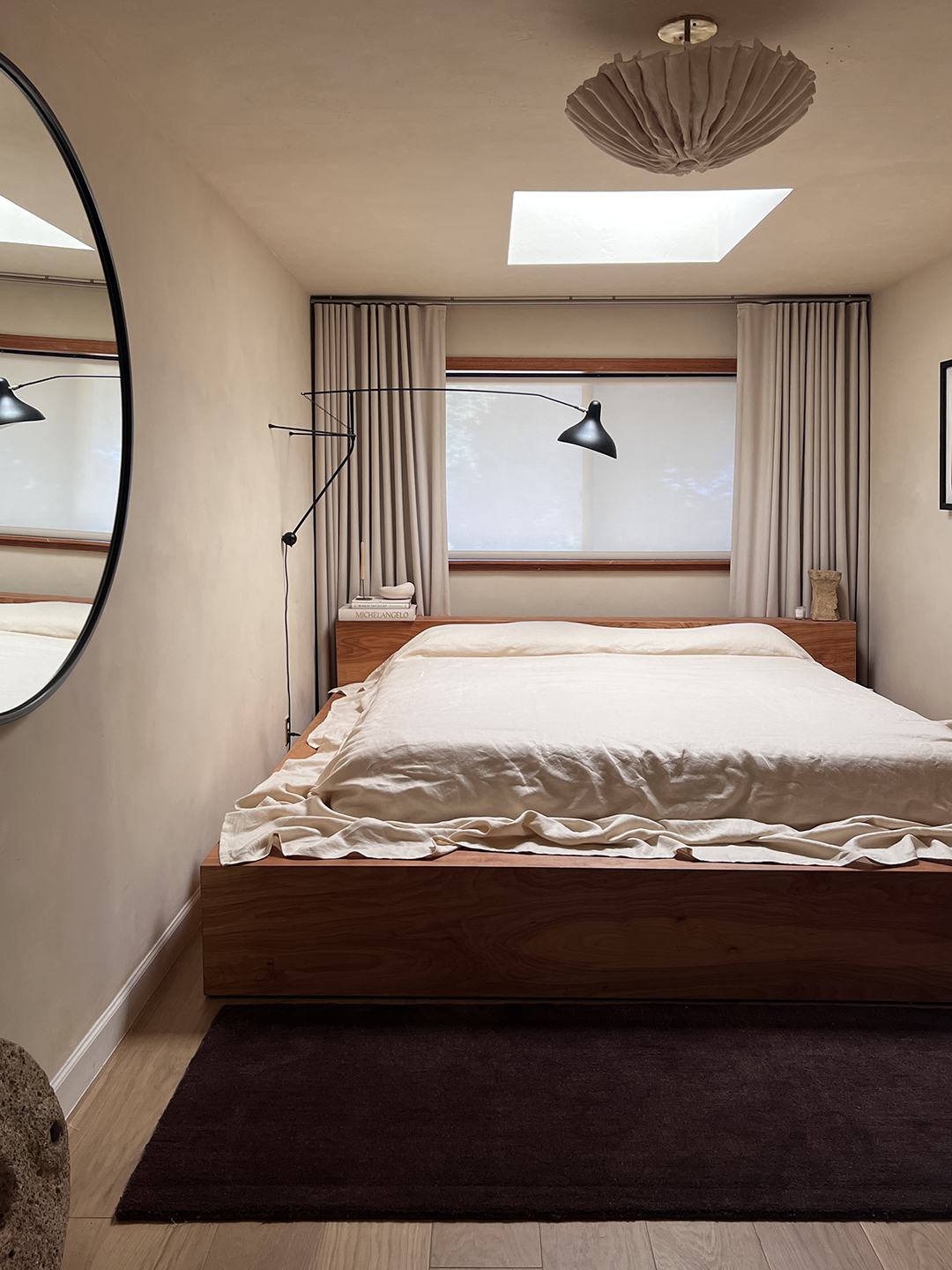 linen bedding on large wood bed