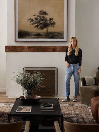 woman by fireplace