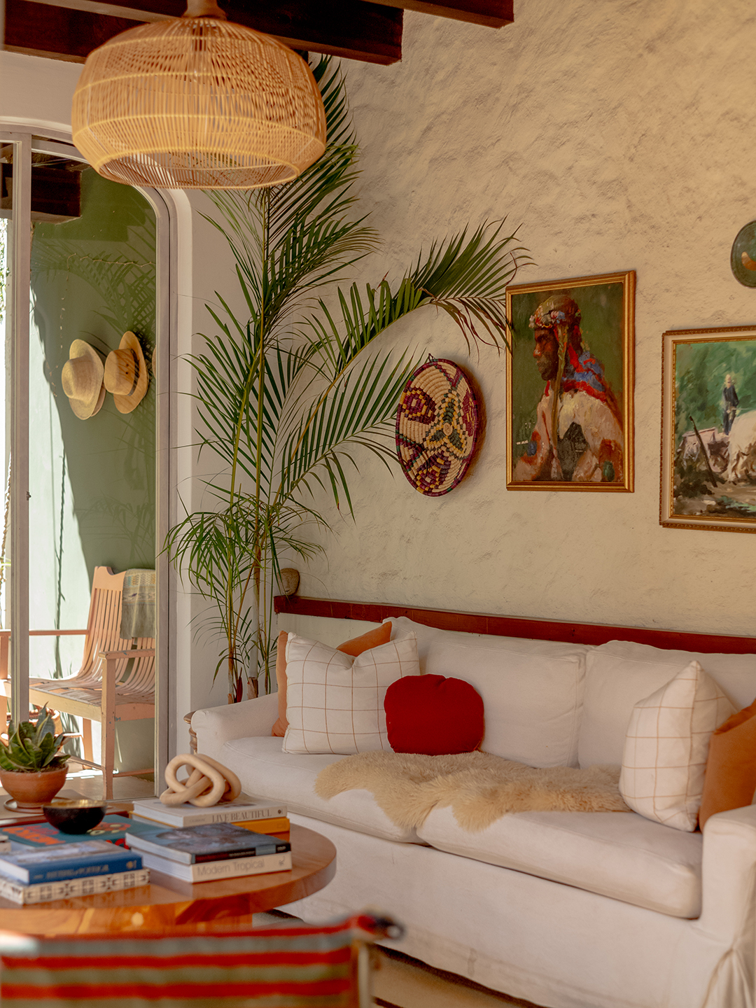 white sofa with sheepskin on top