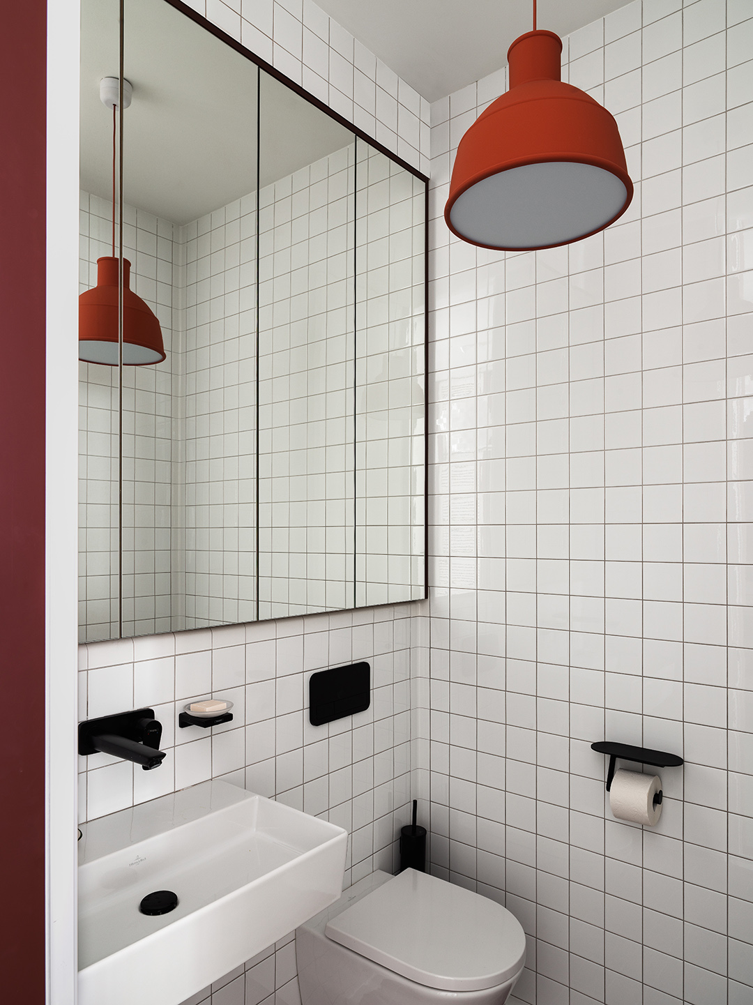 white grid tiled toilet room