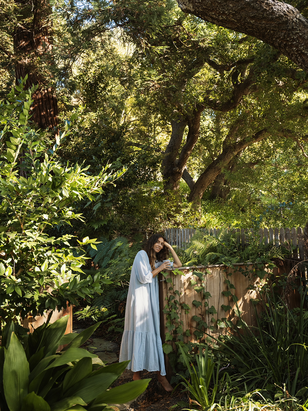 woman leaning on fence