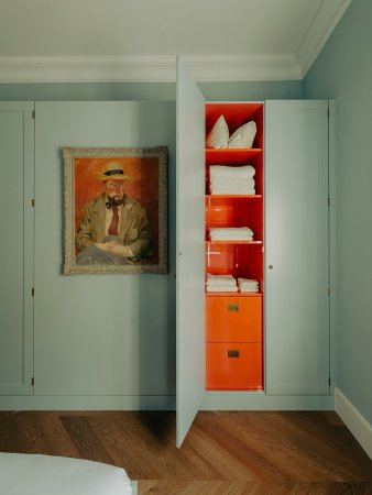 Seaside blue room with orange closet