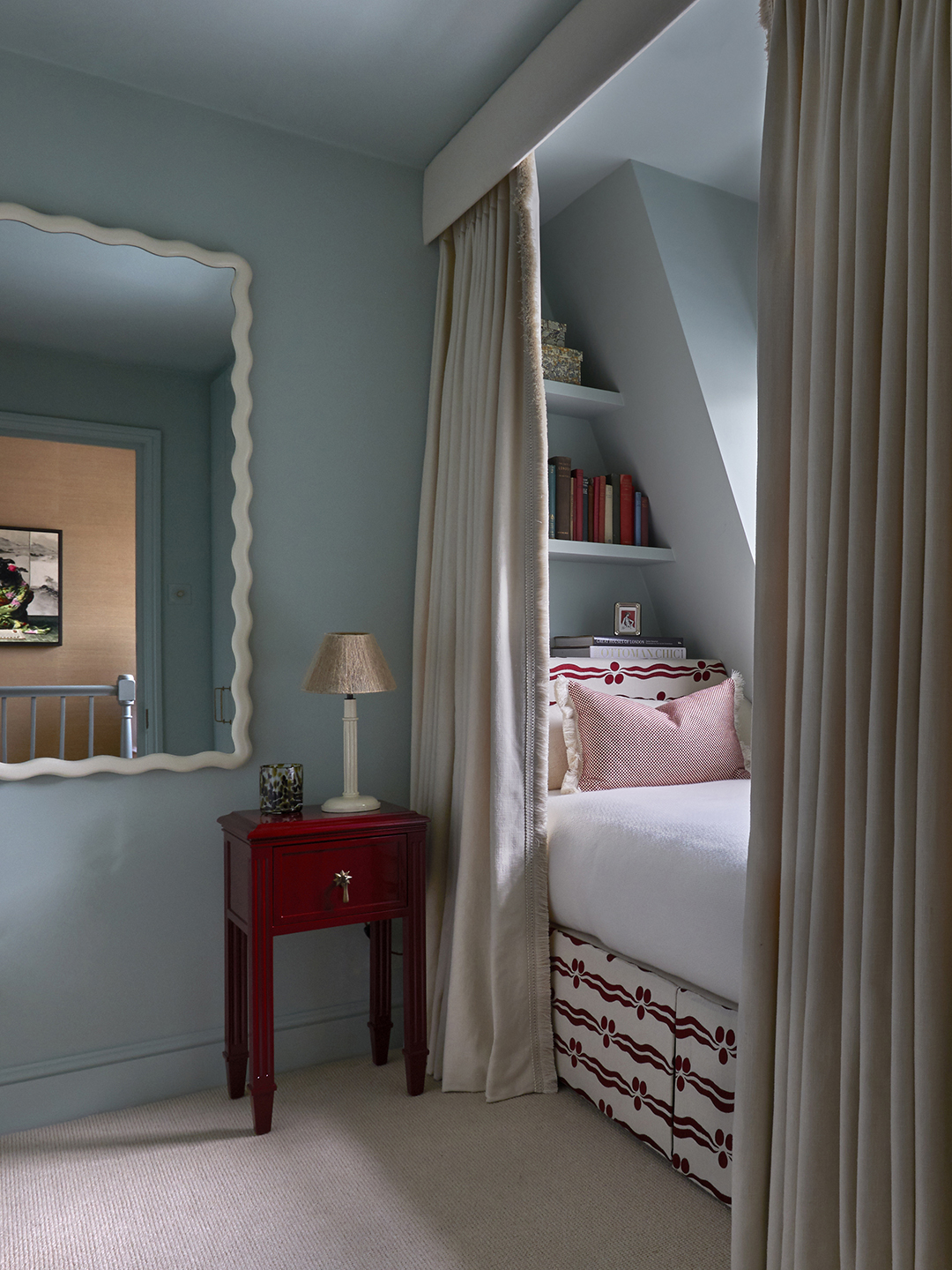 blue bedroom with twin bed in window