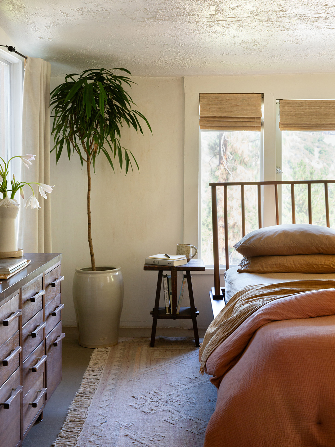 bedroom with tree in corner