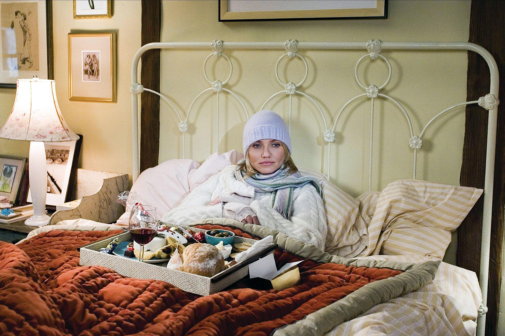 woman in bed with hat and scarf on