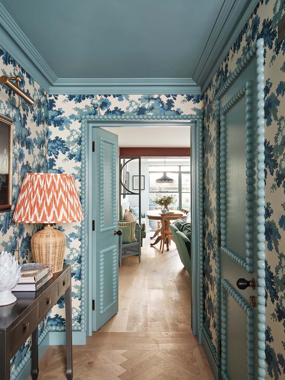 hallway with blue floral wallpaper