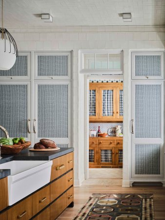 blue fabric paneled cabinets