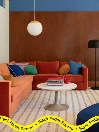 orange sectional sofa with colorful throw pillows