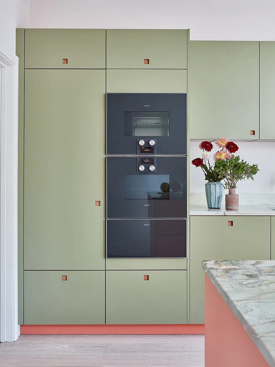 Sage green kitchen with pops of pink