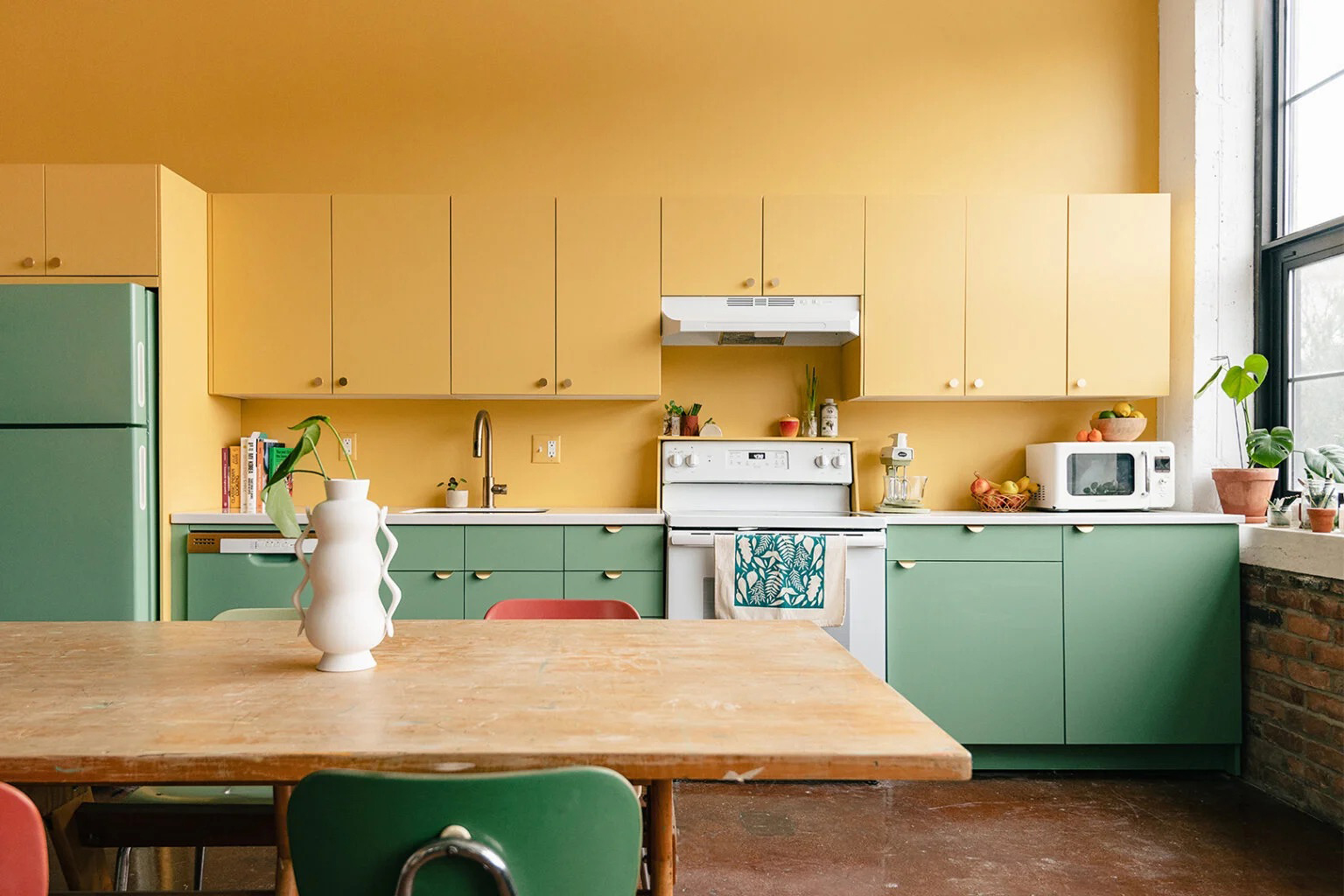 Kitchen with yellow and green cabinets