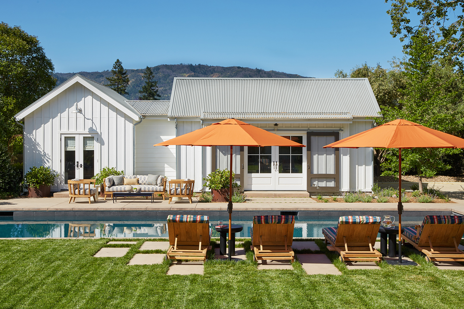 orange umbrellas by pool