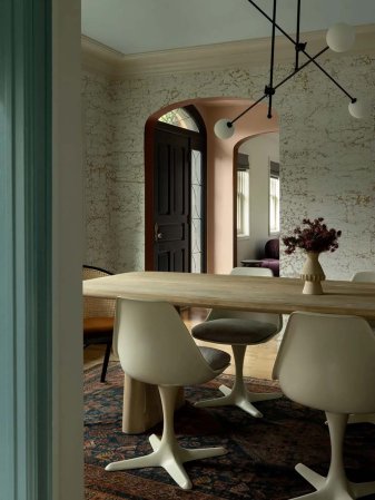 dining room with arched doorway