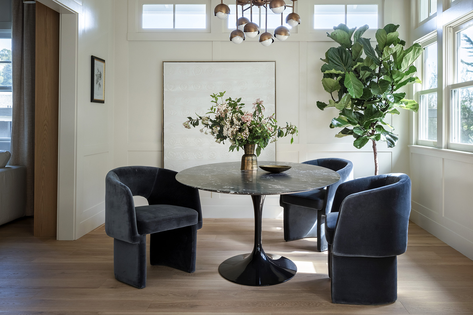 black chairs around round dining table