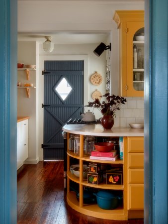 Farmhouse kitchen with ochre cabinets