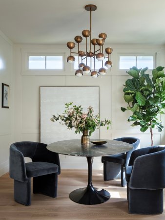 black chairs around round dining table