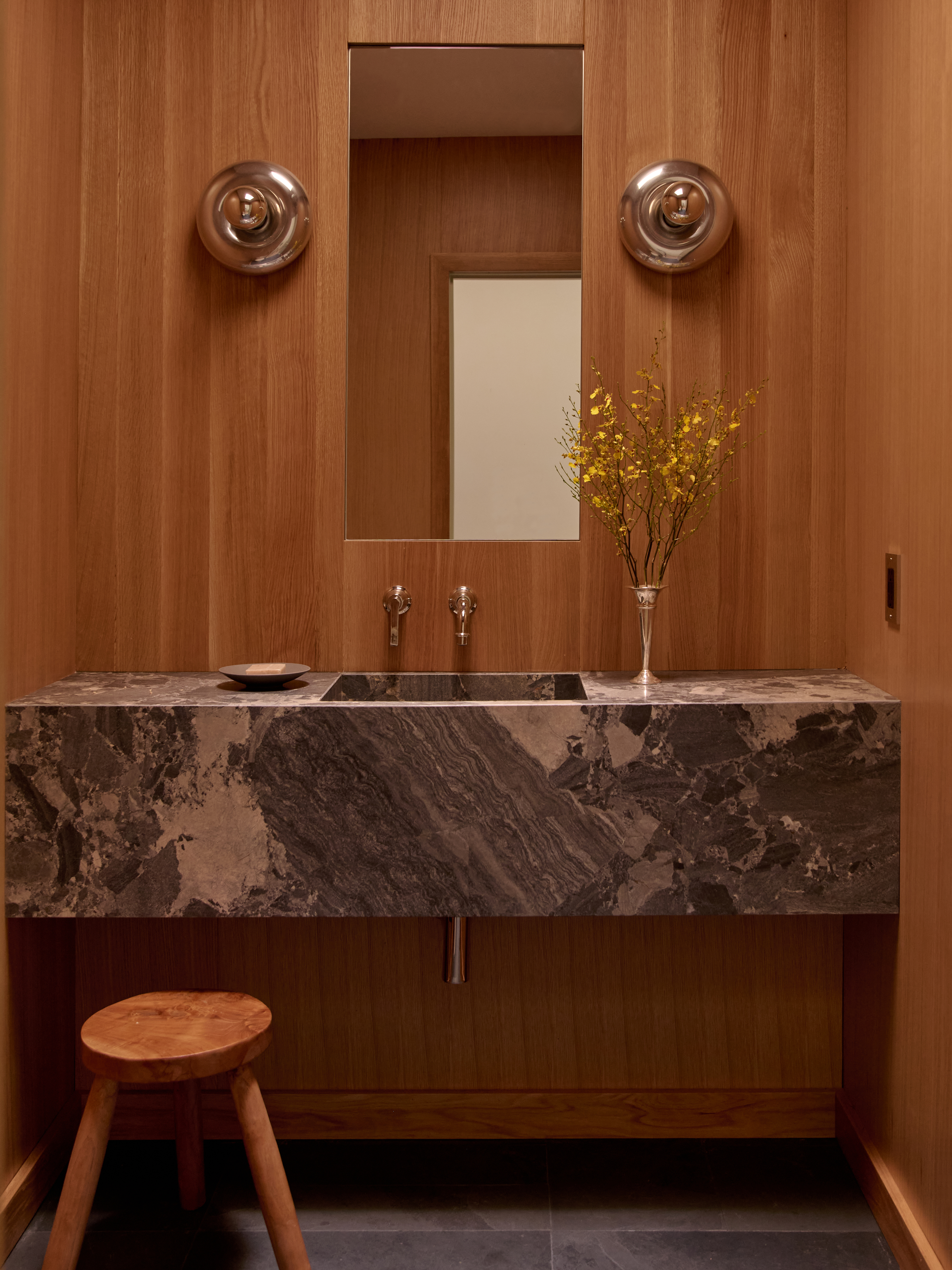 powder bathroom with stone sink