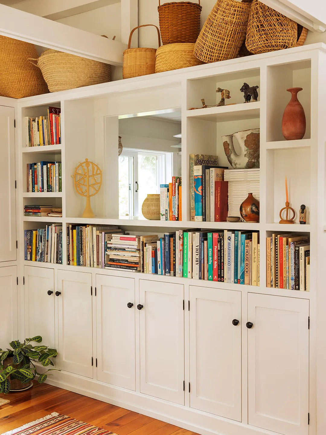 baskets on top of bookcase