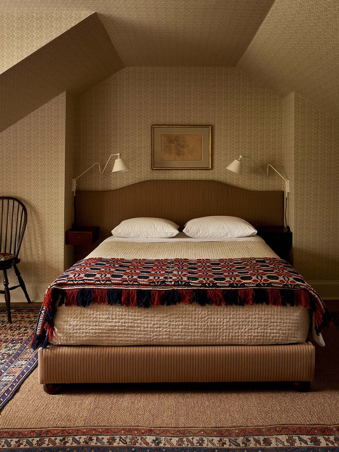 bed with red quilt