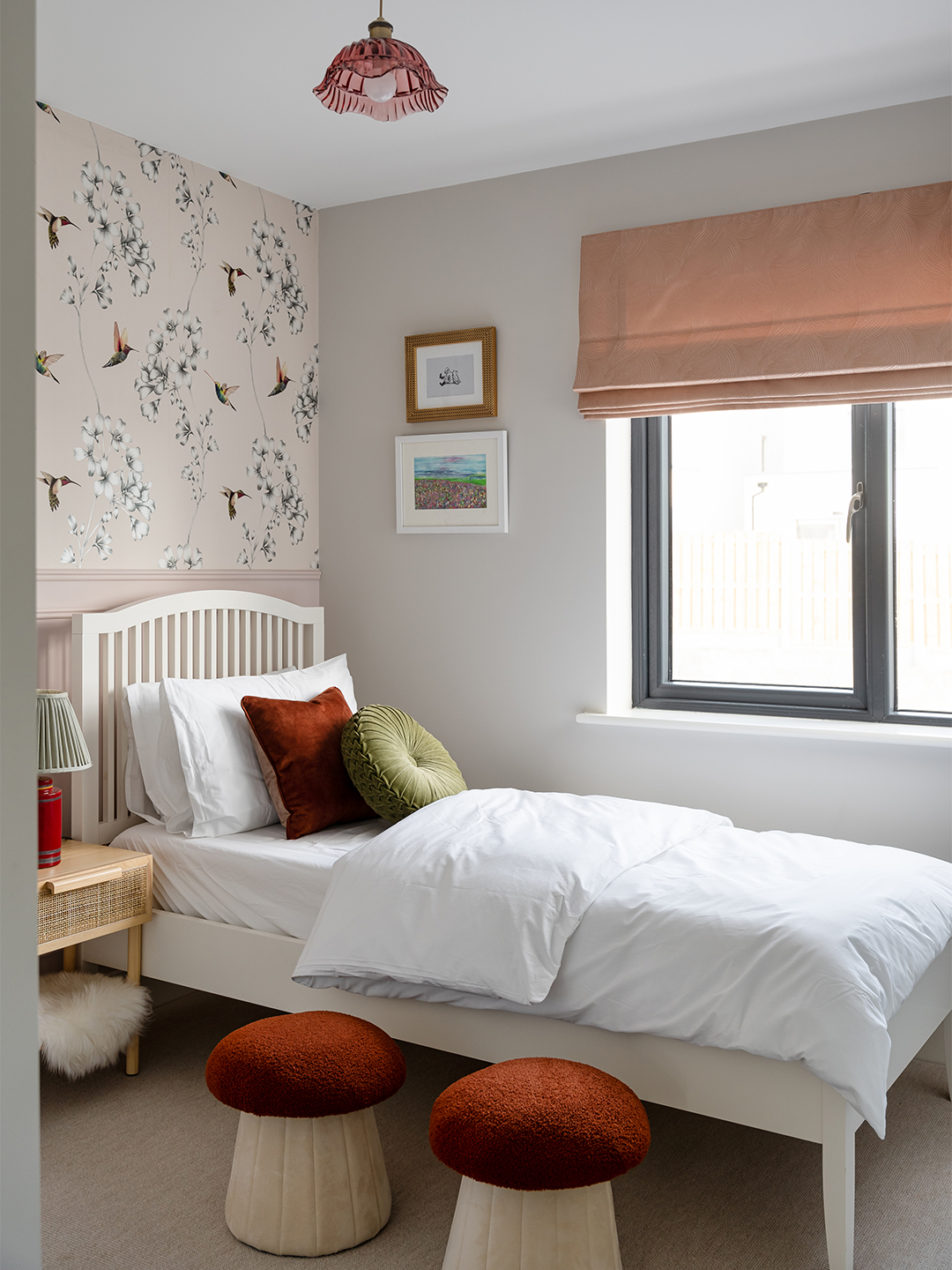 A pink and burnt orange bedroom.