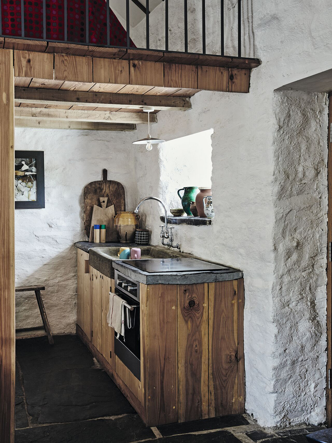 wood kitchen with stone walls