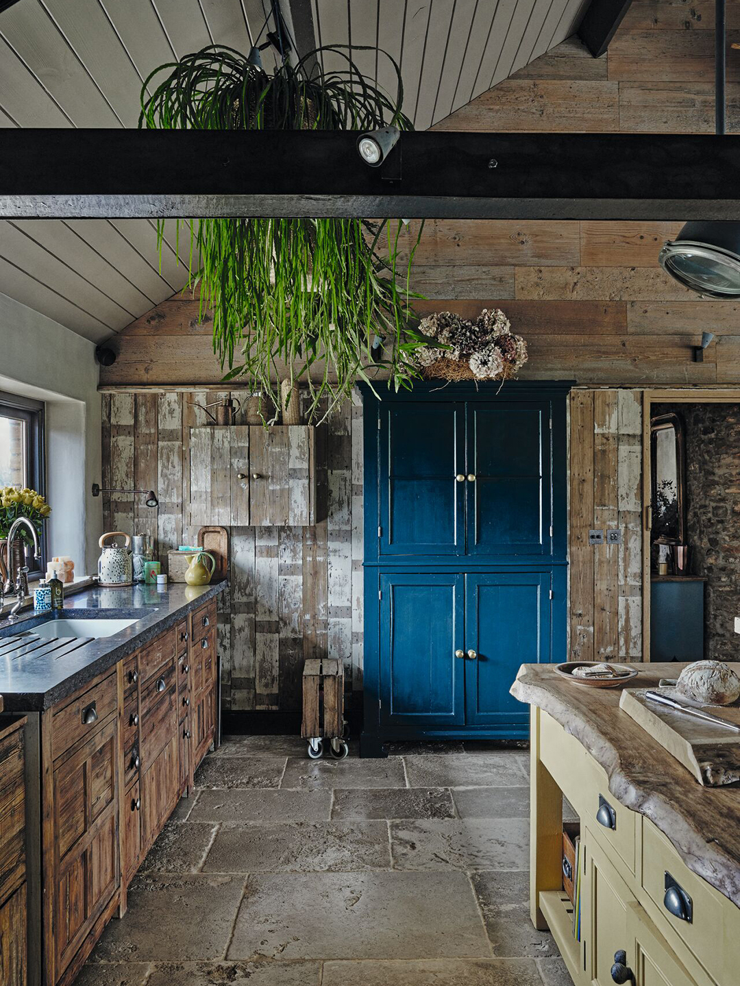 rustic kitchen with blue cabinet