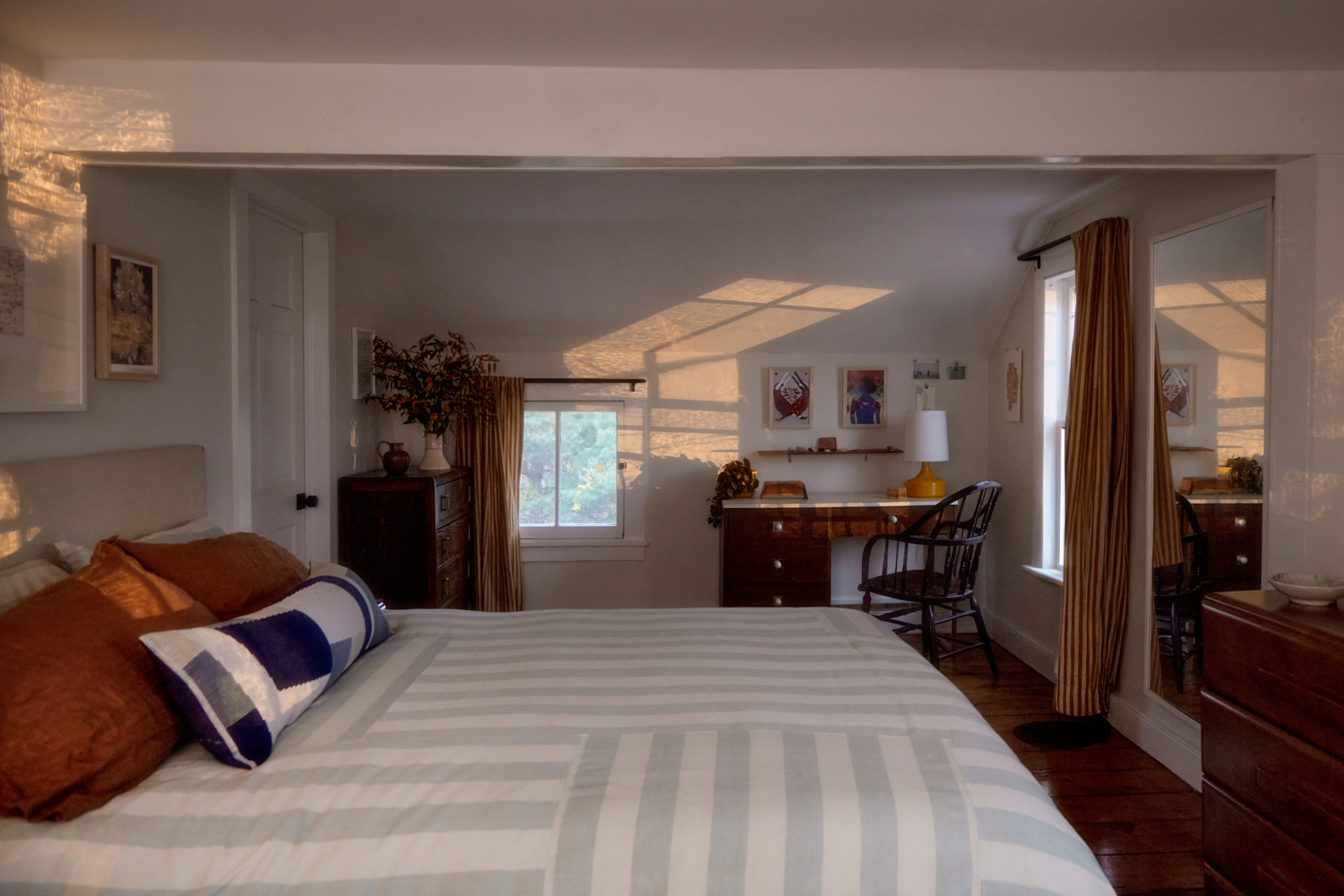 Bedroom with a mix of vintage furniture.