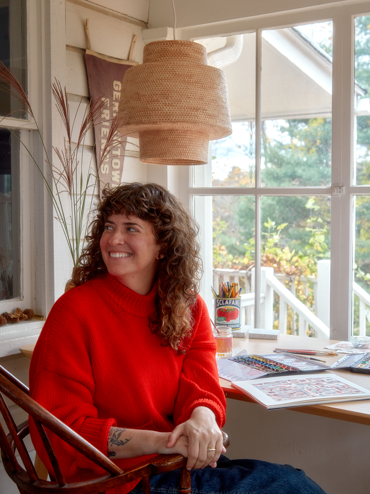 Sara Berks painting in the three-season porch.