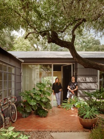 couple in front of house