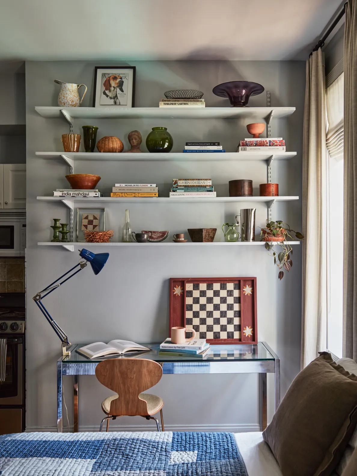 glass desk with shelves above