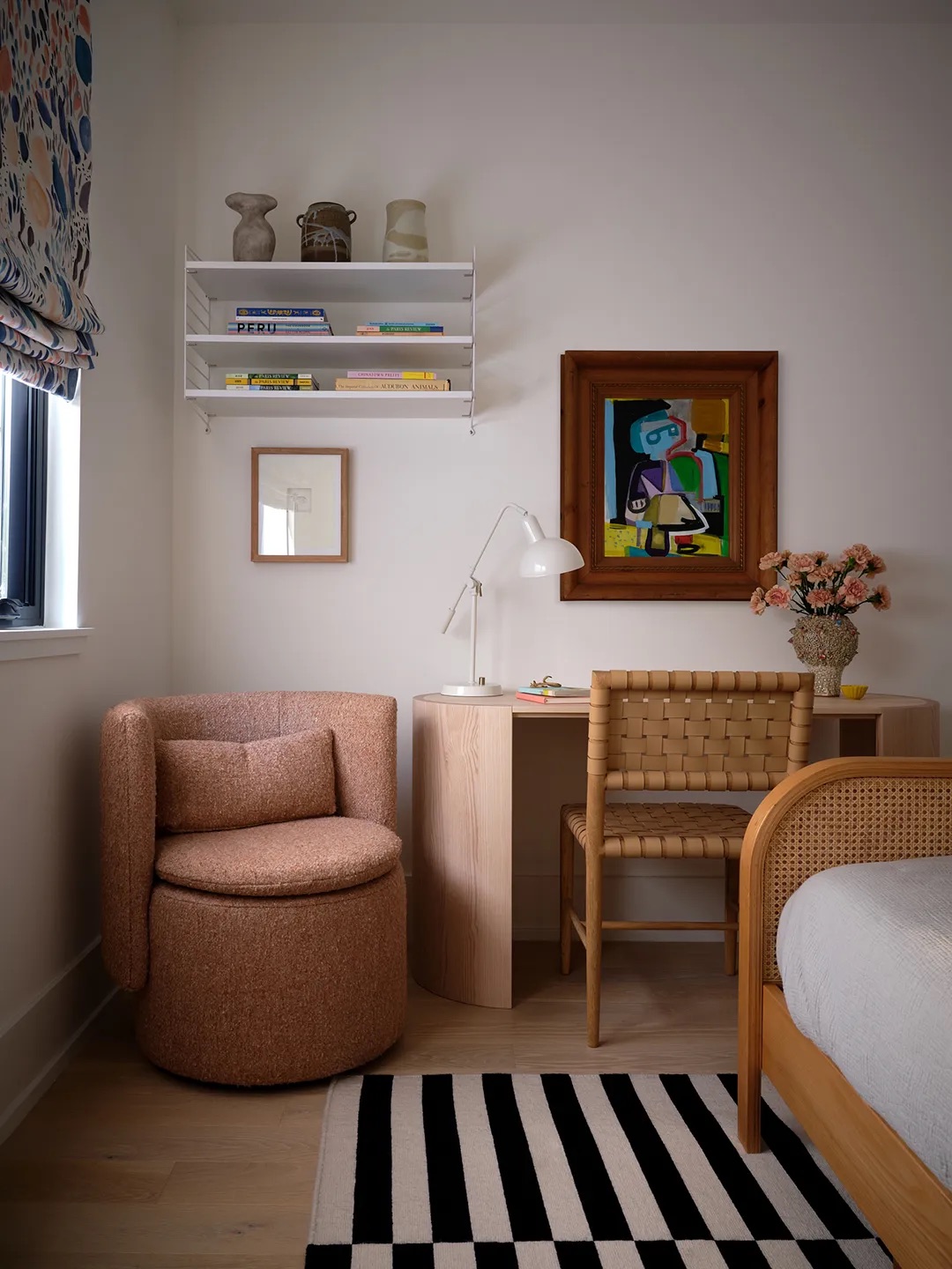 pink chair in corner next to desk