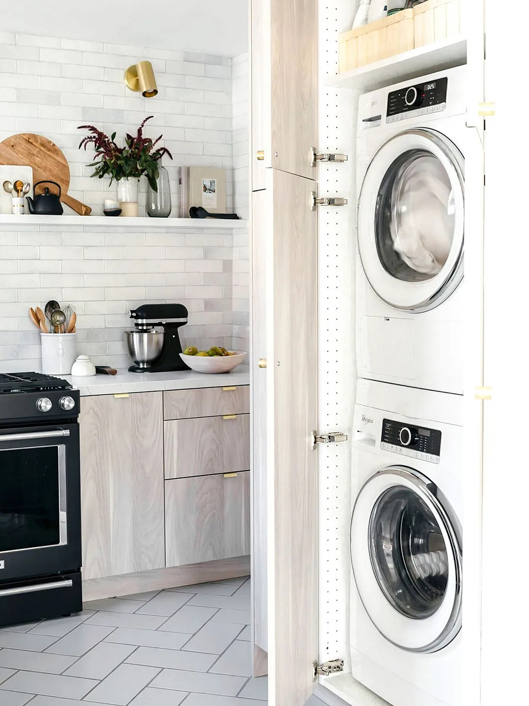 Laundry in kitchen behind cabinets