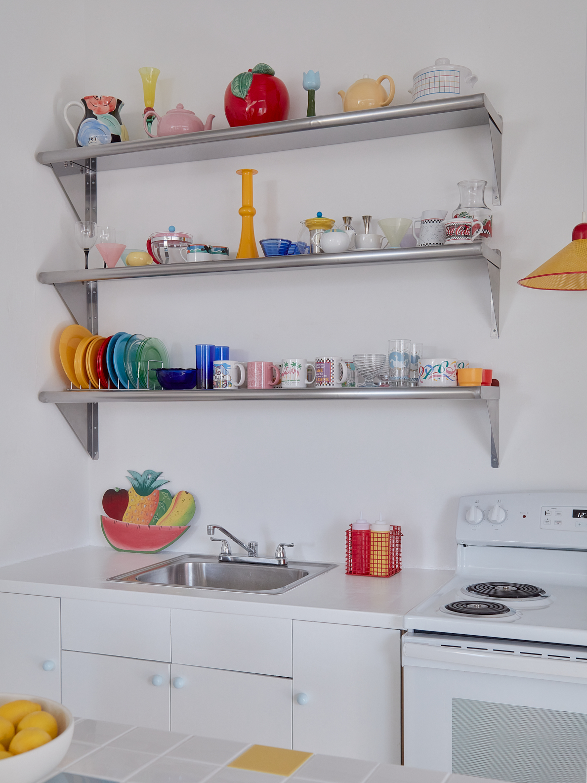 Stainless steel shelving with dishware on display