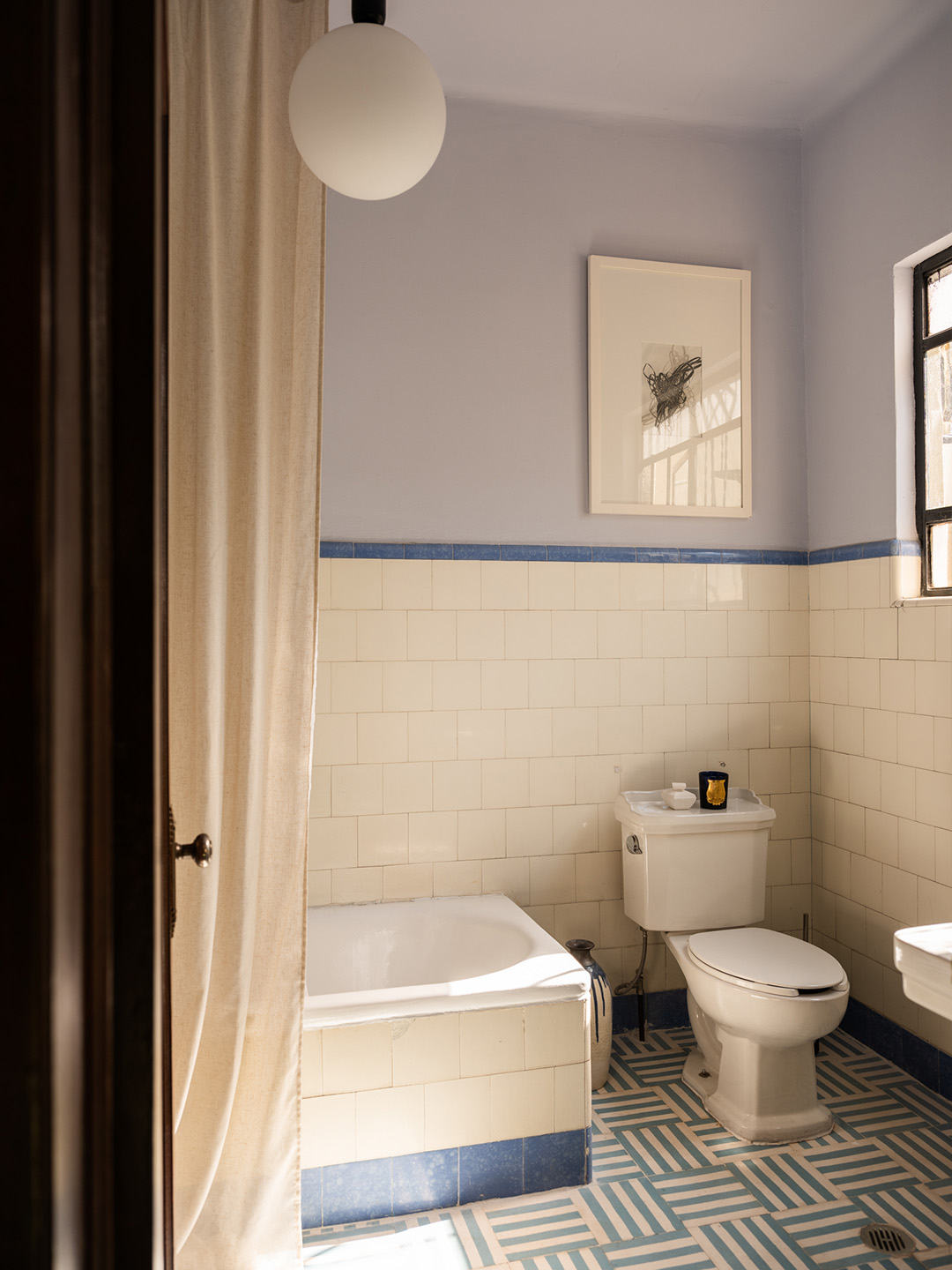 bathroom with blue floor tile