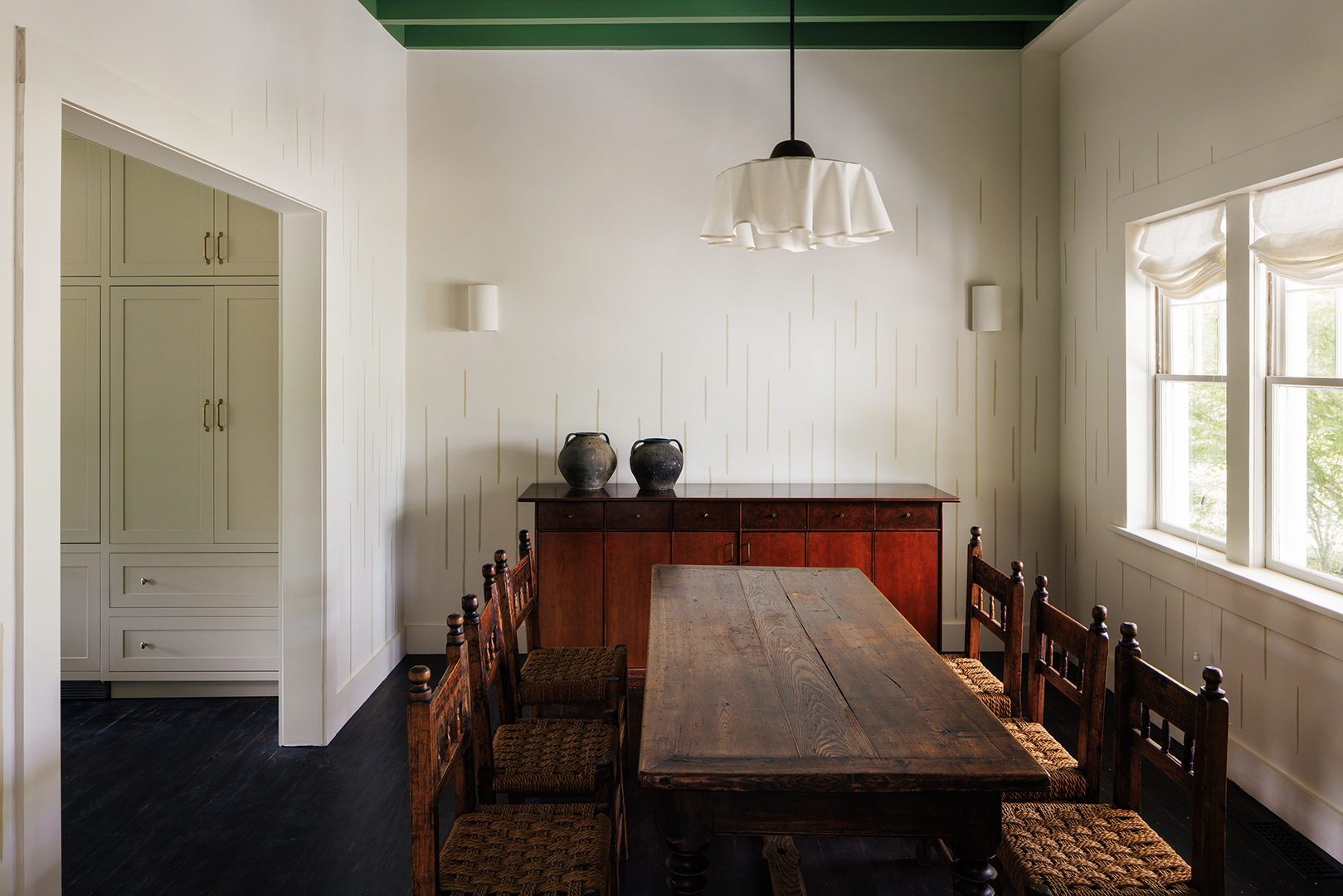 White dining room with wood furnishings