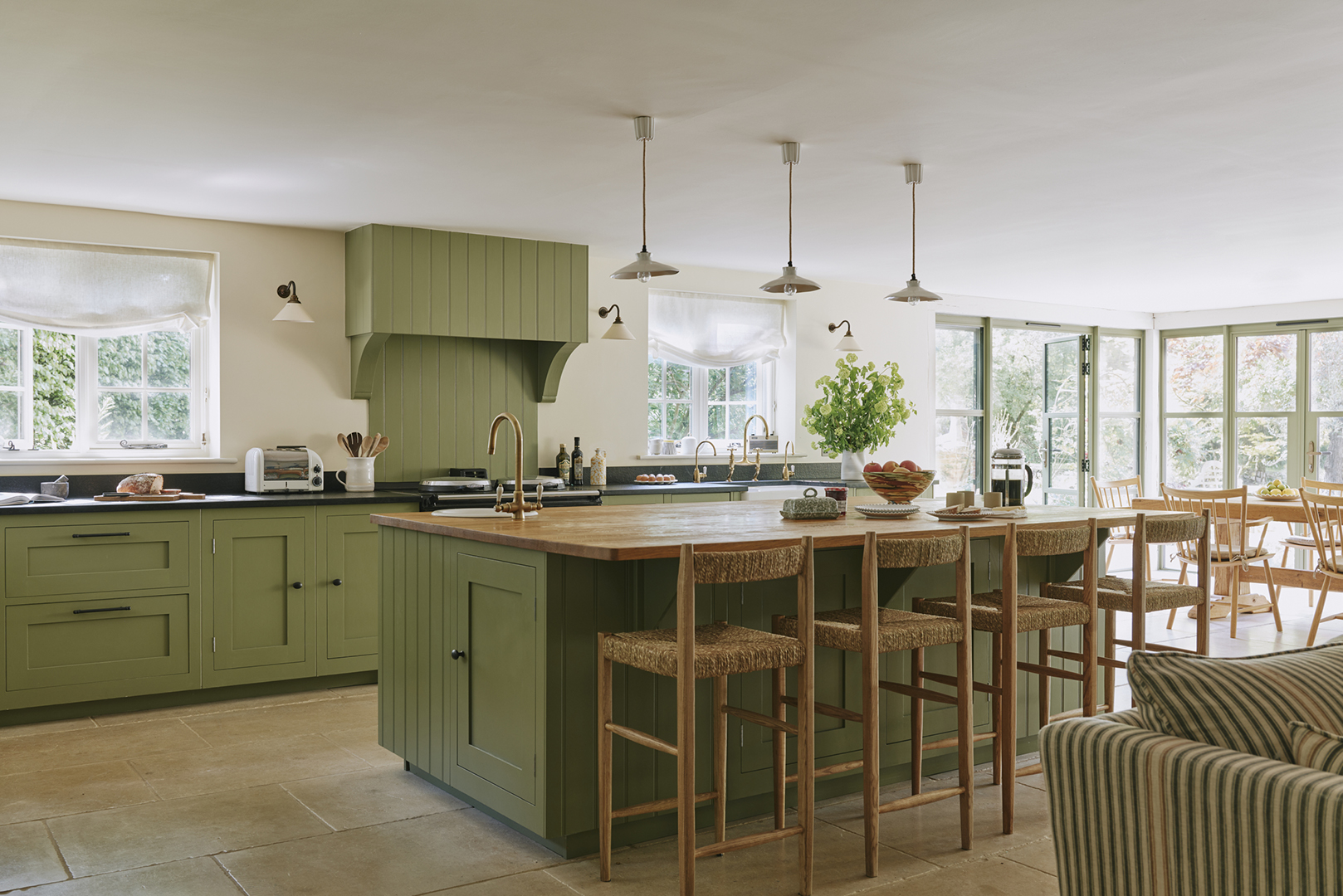 green kitchen with large island