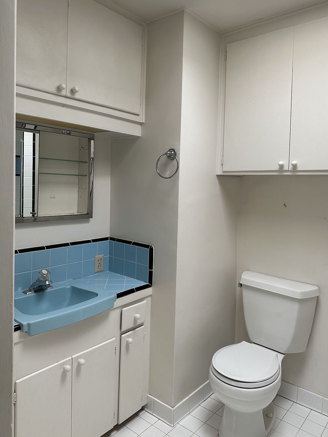 white bathroom with blue sink