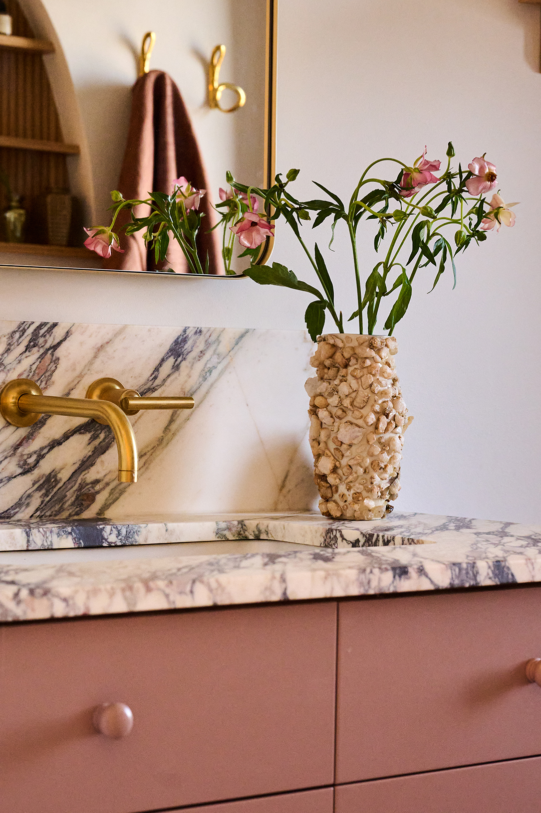 dusty rose vanity with purple-veined marble top