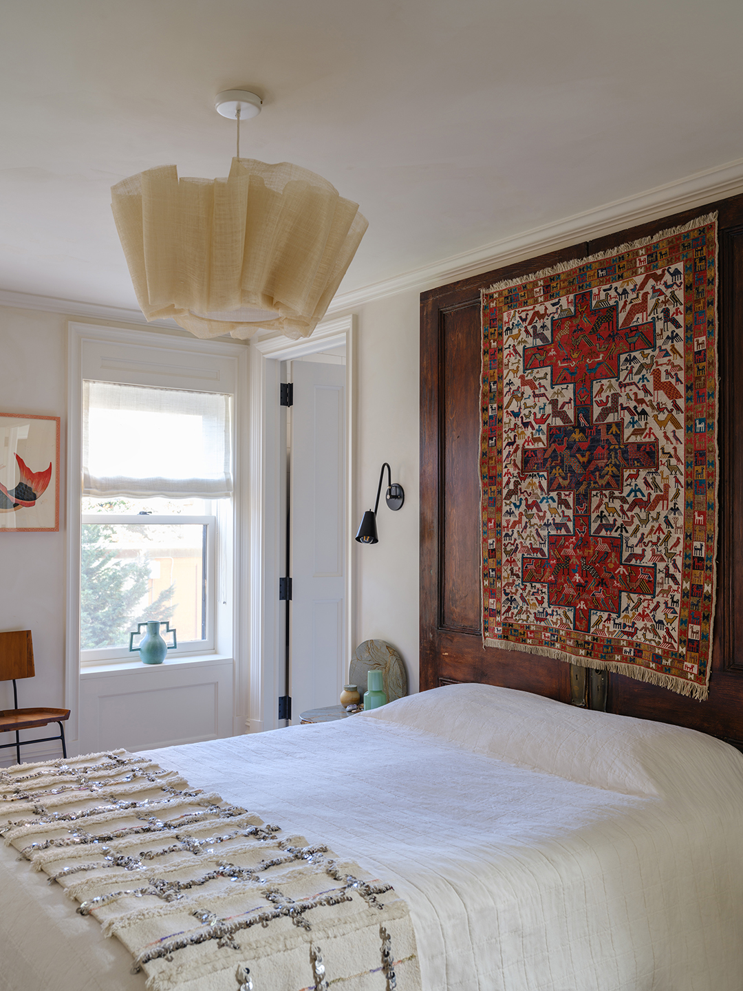 bedroom with tapestry headboard